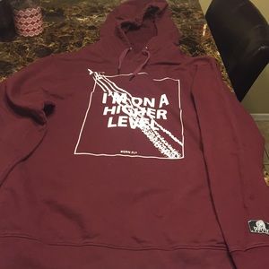 A maroon Born Fly hoodie